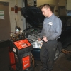 A Motor Works Technician performs a transmission fluid service (flush)
on a Honda Civic